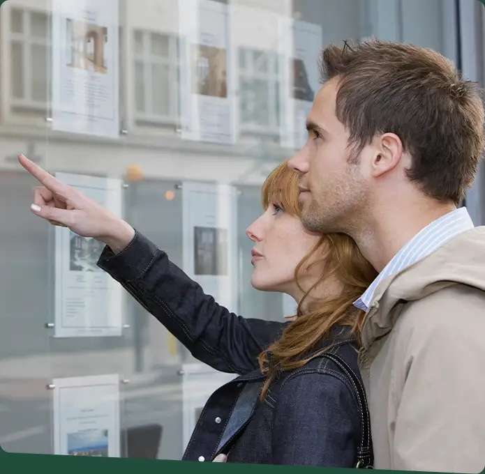 A couple looking at real estate listings