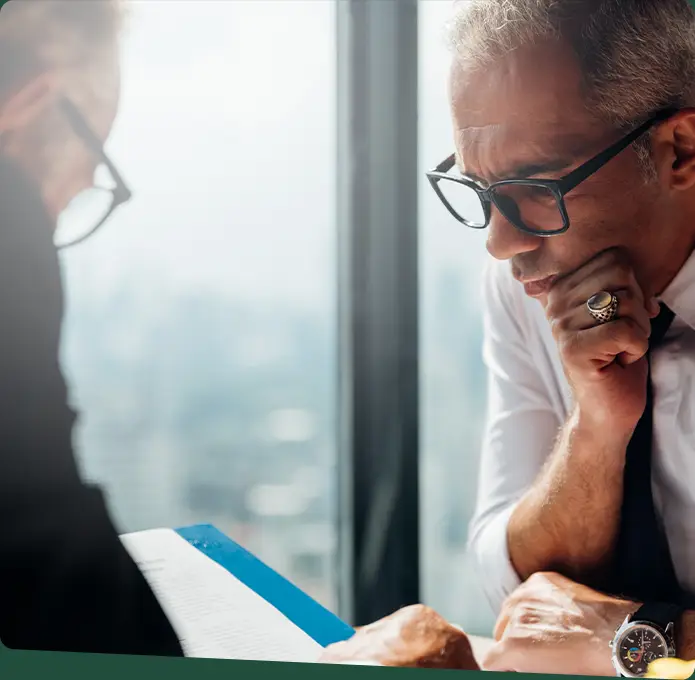 A business man staring intently at a document